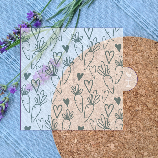 digital image showing a carrot pattern embosser design with hearts, with a cork mat background and lavender pieces