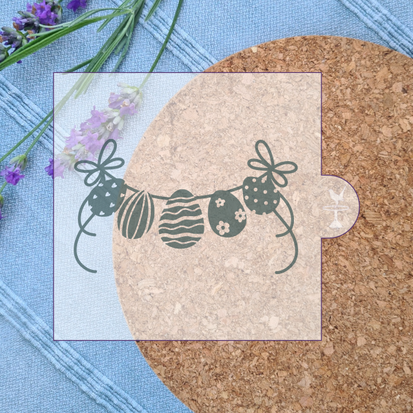 Digital image showing easter egg bunting embosser design with a cork mat background and lavender pieces